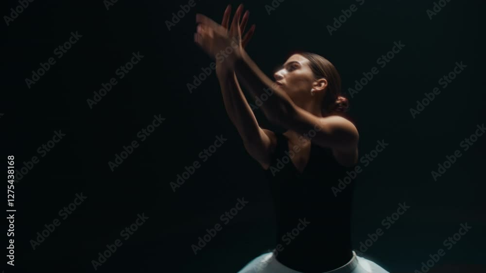 Gorgeous Hispanic woman dancing ballet choreography by rock music, portrait. Passionate ballerina listening to rhythm of drummer and moving in darkness, contemporary art performance, slow motion Gorgeous Hispanic woman dancing ballet choreography by rock music, portrait. Passionate ballerina listening to rhythm of drummer and moving in darkness, contemporary art performance, slow motion