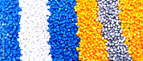 colorful masterbatch granules, masterbatch color combination, polymer carries pigment poured into white background, suitable for industrial plastic company profile product catalog design