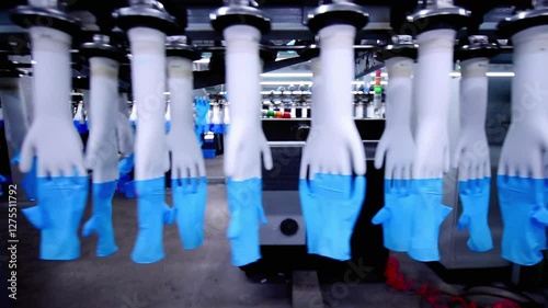 The automated production line in the production workshop of the nitrile glove factory is running for production