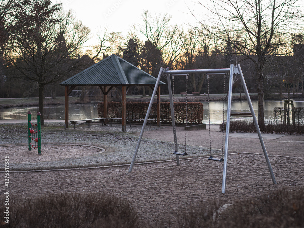 empty playground on a frosty morning in the park empty playground on a frosty morning in the park