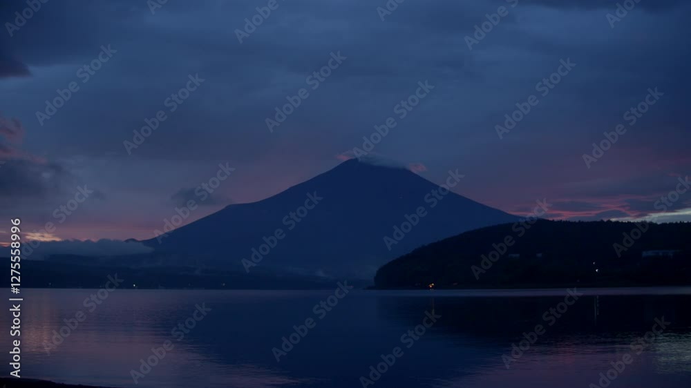 Soft Sunset Glow Over Yamanakako and Fuji – The sky changes into deep blues and soft pastels as Mount Fuji stands tall over Yamanakako Lake Soft Sunset Glow Over Yamanakako and Fuji – The sky changes into deep blues and soft pastels as Mount Fuji stands tall over Yamanakako Lake