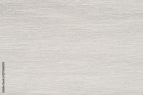 A close-up shot of textured white and gray crepe paper with a subtle, wavy pattern