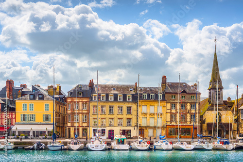 Canvas Print Honfleur village, buildings, church, and sailboats in the harbor