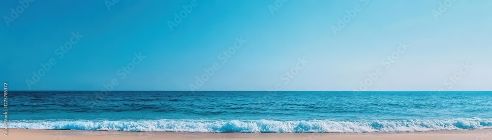 A serene landscape of gentle blue ocean waves softly lapping against a pristine sandy beach, under a clear sky, evoking tranquility and relaxation A serene landscape of gentle blue ocean waves softly lapping against a pristine sandy beach, under a clear sky, evoking tranquility and relaxation