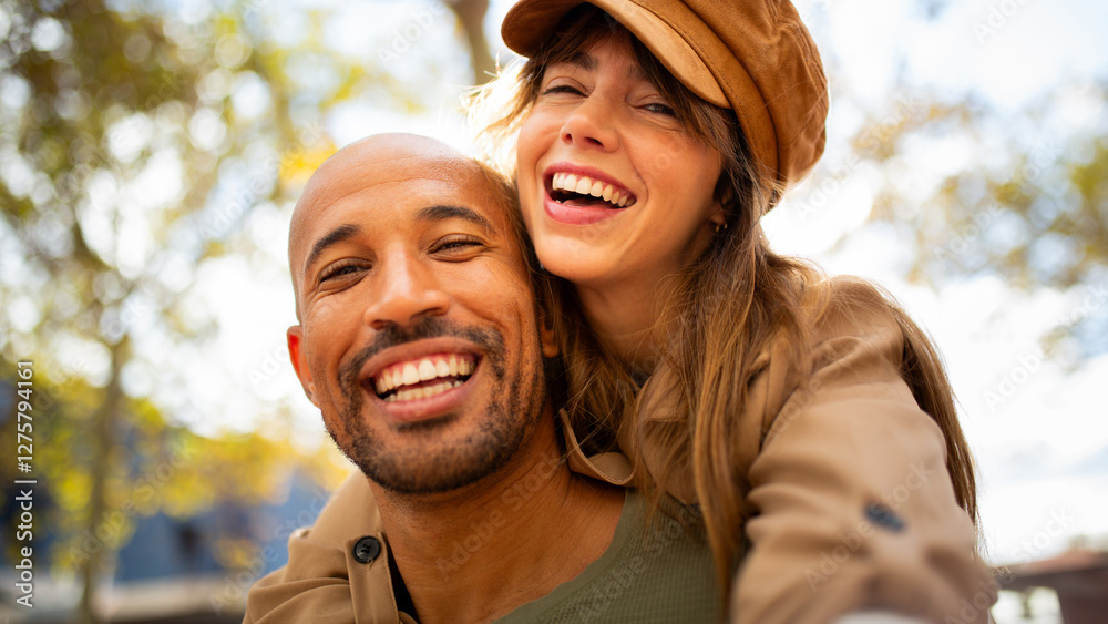 laughing couple creating memories by taking selfie outdoors laughing couple creating memories by taking selfie outdoors