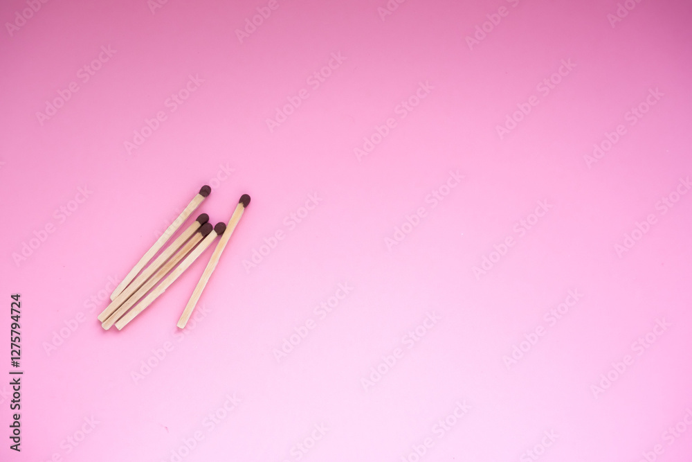 Matches on a pink background. There is a space for the text.The background for the holiday of the day of the match. Matches on a pink background. There is a space for the text.The background for the holiday of the day of the match.