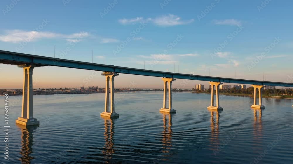 Coronado Bridge in San Diego, California at sunrise. Slow drone pull-away shot. Coronado Bridge in San Diego, California at sunrise. Slow drone pull-away shot.