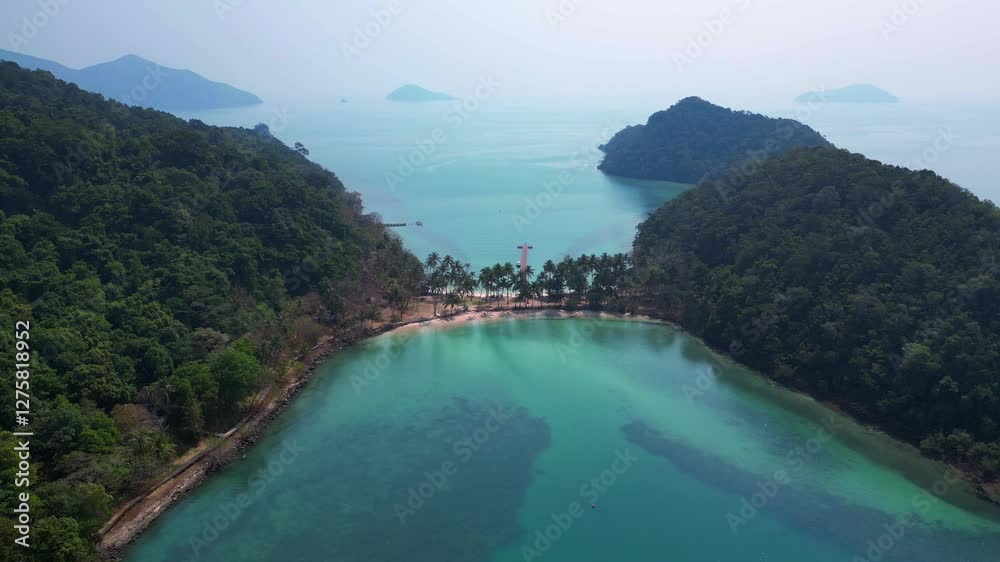Scenic aerial view of lush green hills and turquoise waters on Koh Chang Ngam Island. Best aerial view flight ascending drone Scenic aerial view of lush green hills and turquoise waters on Koh Chang Ngam Island. Best aerial view flight ascending drone