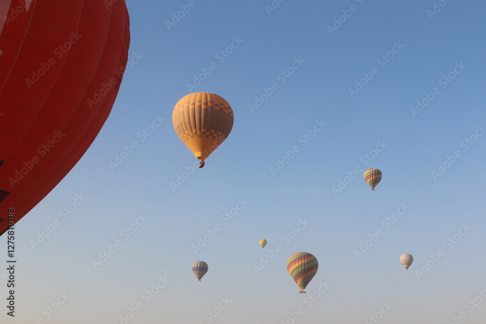 Fototapeta premium Hot air balloons flying in Luxor in the morning, Egypt