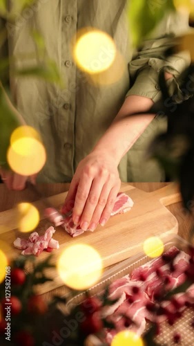 Woman Slicing Raw Bacon in a Cozy Kitchen