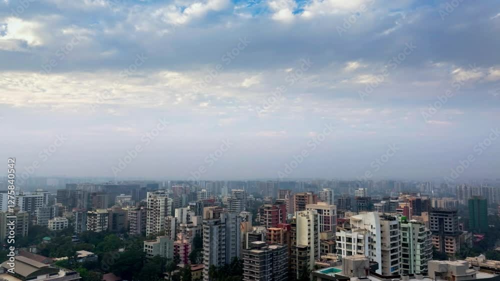Aerial drone shot of Mumbai cityscape with high-rise buildings under a blue sky with clouds. Scenic urban skyline view of modern architecture and city growth. Aerial drone shot of Mumbai cityscape with high-rise buildings under a blue sky with clouds. Scenic urban skyline view of modern architecture and city growth.
