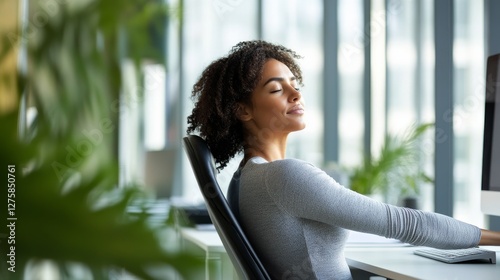 Obraz na płótnie Shoulder stretch in a tranquil office space with a clean desk. Featuring clarity and mindfulness w salonie