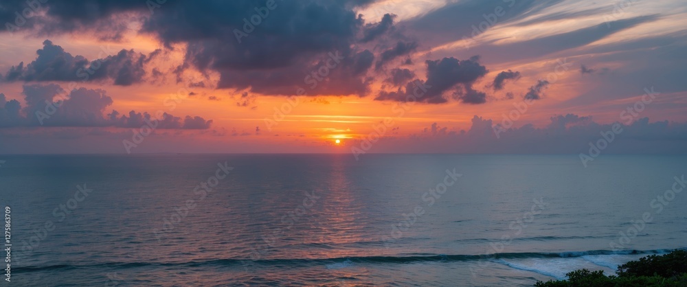 Serene Coastal Sunset with Dramatic Cloud Cover Over the Ocean and Inter Coastal Waterway Serene Coastal Sunset with Dramatic Cloud Cover Over the Ocean and Inter Coastal Waterway