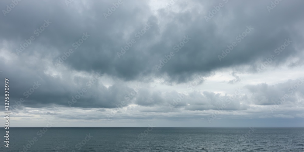 Dramatic Overcast Sky Above Tranquil Sea with Ample Copy Space for Creative Text or Branding Dramatic Overcast Sky Above Tranquil Sea with Ample Copy Space for Creative Text or Branding