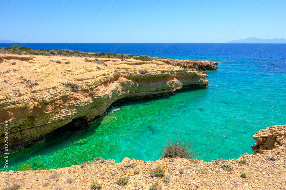 Koufonisia beach with clear water and rock formations. The south of Ano Koufonisi. Small Cyclades, Greece