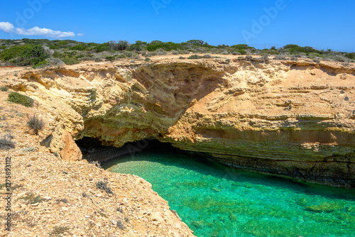 Koufonisia beach with clear water and rock formations. The south of Ano Koufonisi. Small Cyclades, Greece photo