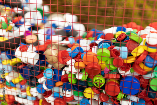 Colorful plastic caps gathered for recycling purposes photo