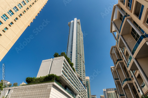 Low angle view to skyscrapers in Dubai, UAE.