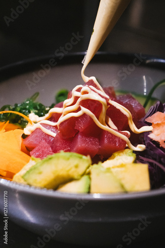 Close Up Tuna Poke Bowl Preparation With Sauce