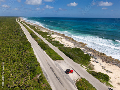 Coast in Mexico, Cozumel island, photo from the drone of the road, car, beach and Caribbean Sea