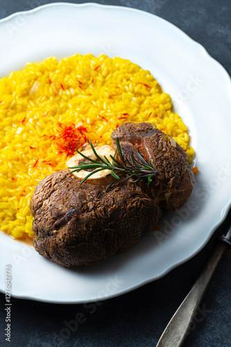 Wallpaper Mural Beef Meat on the bone with Spinal cord in Italian cuisine, a classic recipe of  Ossobuco or Ossbus, Lombard cuisine, served with risotto or polenta and cooked for a long time with vegetables in wine  Torontodigital.ca