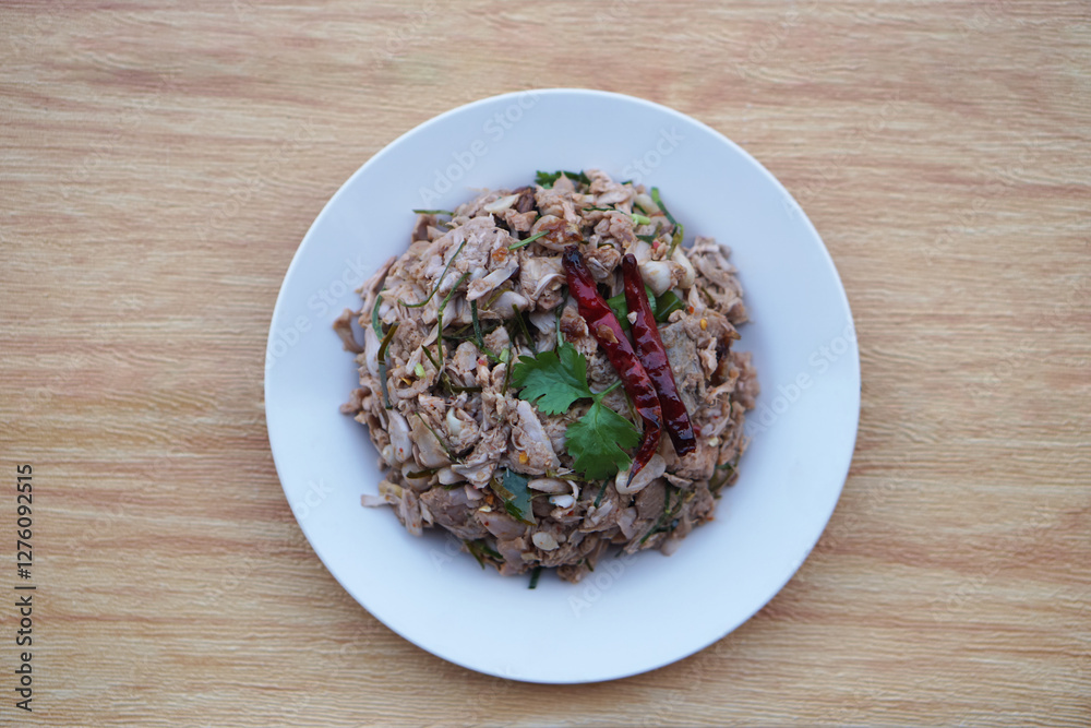 Homemade spicy young jackfruit salad, mixed with herbal food ingredient, serve in dish. Concept, local traditional food in Thailand. Delicious healthy menu. Top view. Homemade spicy young jackfruit salad, mixed with herbal food ingredient, serve in dish. Concept, local traditional food in Thailand. Delicious healthy menu. Top view.