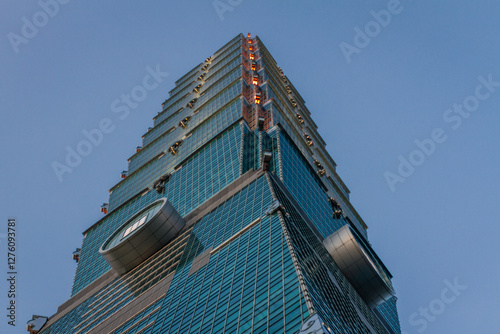 Iconic Modern Skyscraper Featuring Glass Facade and Distinctive Architectural Design in Taipei Skyline photo