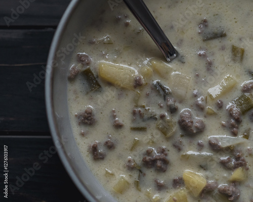 Festliche Hackfleisch-Lauch-Suppe mit Kartoffelstücken für kalte Tage photo