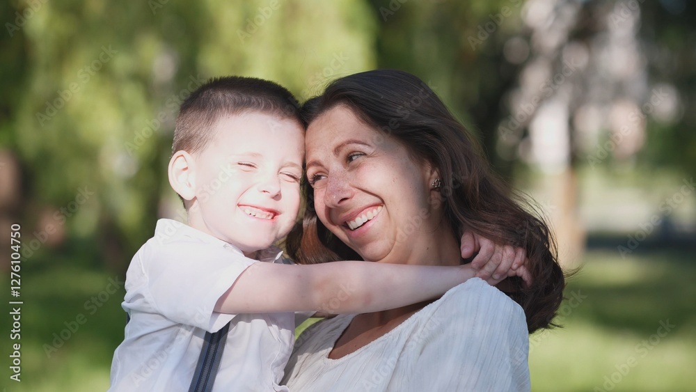 A heartwarming moment between a beloved mother and her young son enjoying the outdoors, radiating joy together A heartwarming moment between a beloved mother and her young son enjoying the outdoors, radiating joy together