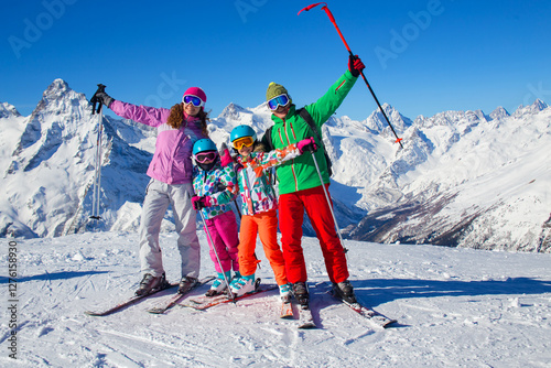 Obraz na płótnie Portrait of a sporting family in equipment at a ski resort w salonie