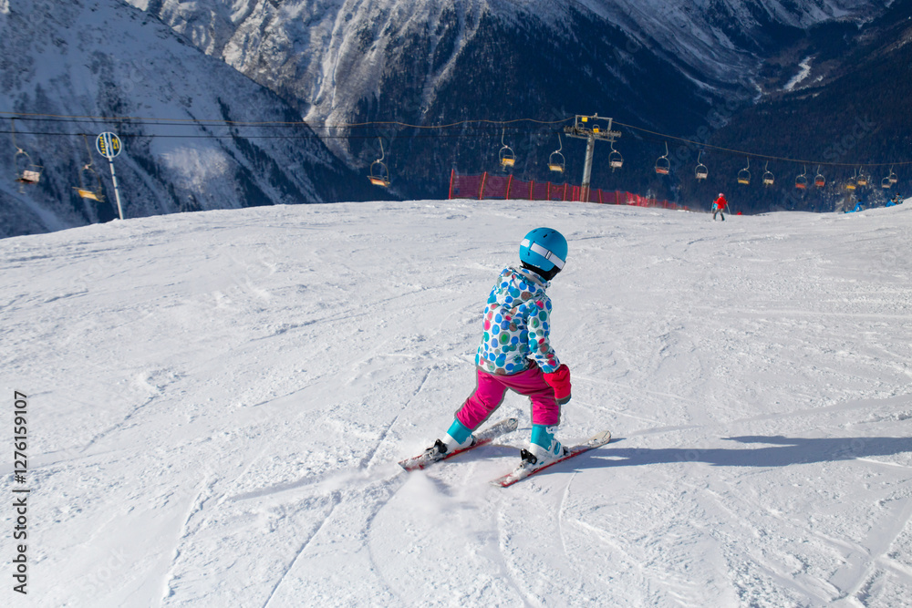 little girl in ski resort