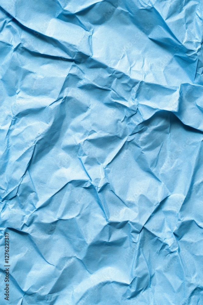 Obraz premium Crumpled blue paper texture for creative background and design projects
