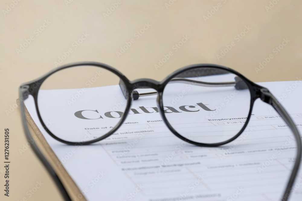 contract paper viewed from eyeglasses contract paper viewed from eyeglasses