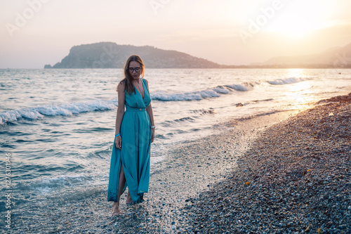 Woman in Flowing Dress on S...