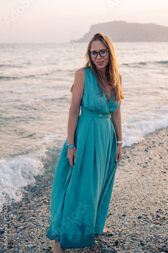 Woman in Flowing Dress on S...