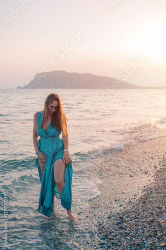 Woman in Flowing Dress on S...