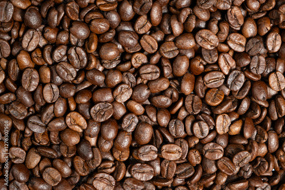 Decaffeinated coffee beans roasted close up Decaffeinated coffee beans roasted close up