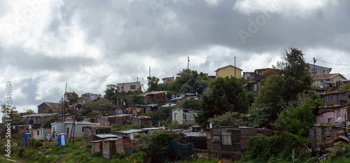 South Africa informal settlement on a hill, houses made of corrugated metal sheet and cardboard
