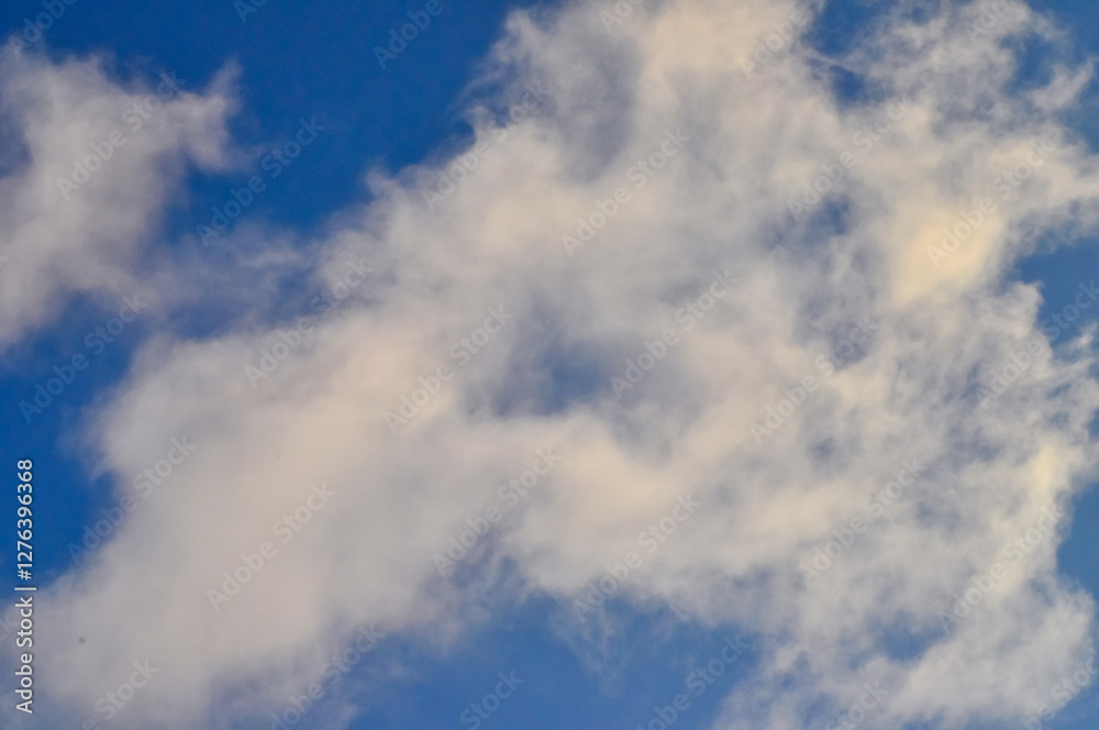 Clouds on the background of a bright blue winter sky Clouds on the background of a bright blue winter sky