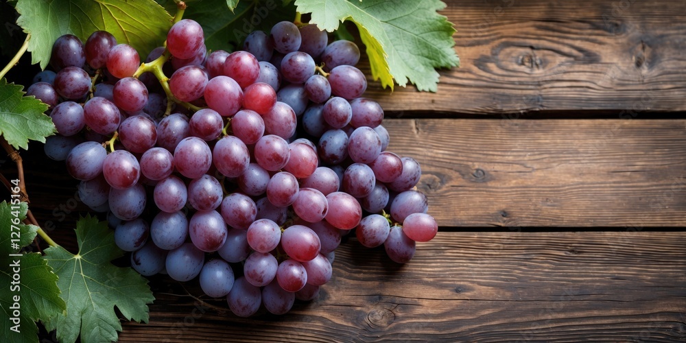 Bright bunch of red and purple grapes with green leaves on rustic wooden surface. Healthy organic fruit photography. Bright bunch of red and purple grapes with green leaves on rustic wooden surface. Healthy organic fruit photography.