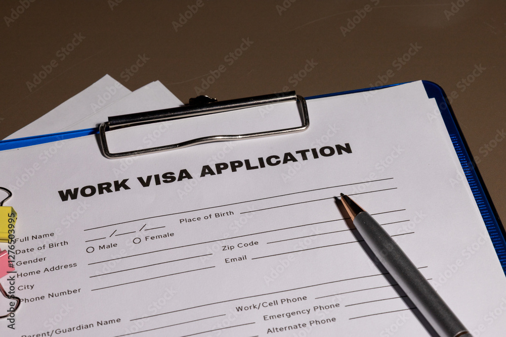 A formal setup featuring a work visa application in a clipboard, symbolizing career opportunities abroad. A formal setup featuring a work visa application in a clipboard, symbolizing career opportunities abroad.