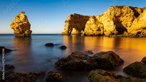 Marinha beach (Praia da Marinha) beaches in Portugal's Algarve region. The rocky Atlantic coast at sunrise, in the golden hour.
