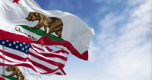 California state flags and the American flag waving in the wind