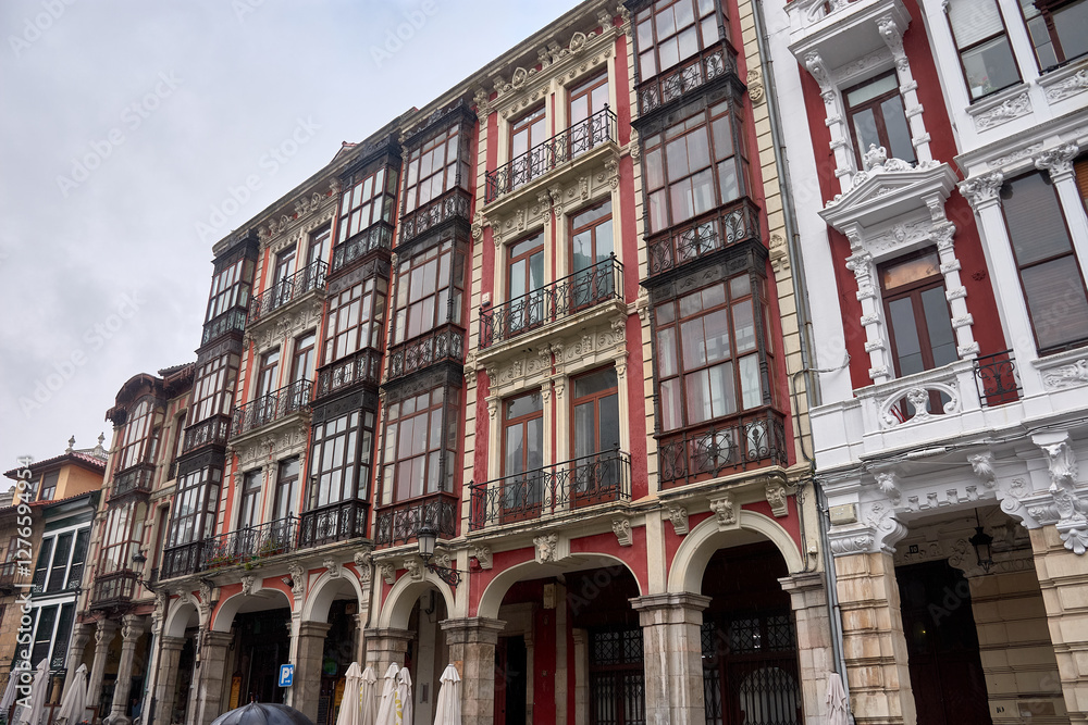 Ornate facades of old town buildings reflecting the architectural beauty of Aviles Ornate facades of old town buildings reflecting the architectural beauty of Aviles
