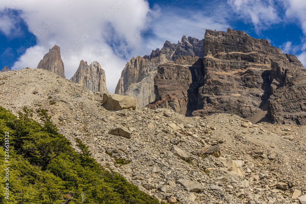 Fototapeta premium Torres del Paine national park mountain landscape in Patagonia, Chile. Los Cuernos and Torres del Paine peak granite towering summits on a nasty and sunny day above the blue water lake in the Andes