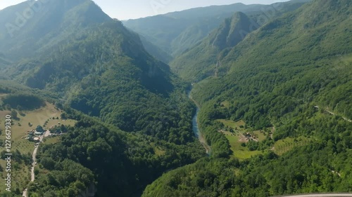 Aerial drone view of the Tara River Canyon and the massive concrete Djurdjevic Bridge in the mountains of Montenegro photo