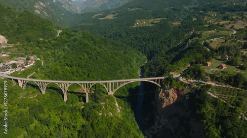 Aerial drone view of the Tara River Canyon and the massive concrete Djurdjevic Bridge in the mountains of Montenegro