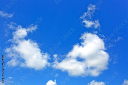 Blue sky background with white clouds. Nature summer background.