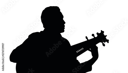 Silhouette of a man playing guitar
