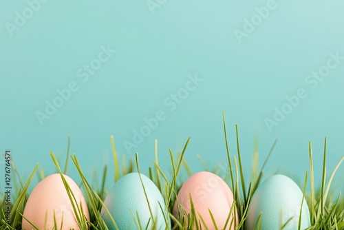 brightly colored easter eggs nestled in fresh green grass against vibrant blue sky
